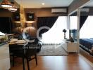 Modern furnished apartment living and dining area with open bedroom view