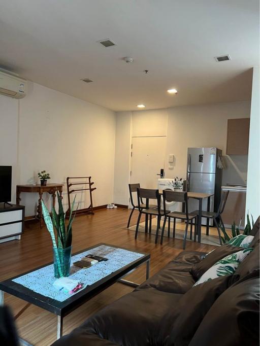 Spacious living room with dining area and modern furniture