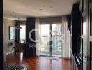 Modern living room with city view through large windows