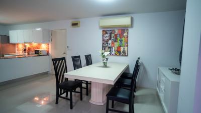 Modern kitchen with integrated dining space featuring stylish decor