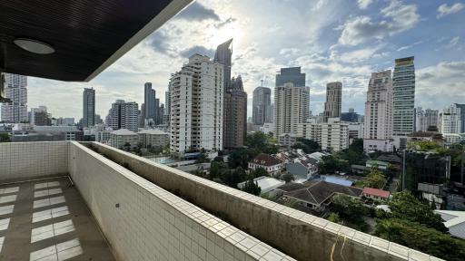 Spacious balcony with city skyline view and ample daylight