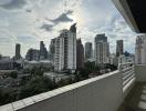 Expansive city view from high-rise apartment balcony