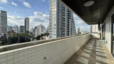 Spacious balcony with city skyline view