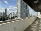 Spacious balcony with city skyline view