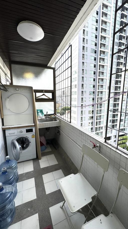 Modern laundry room with city view and natural lighting