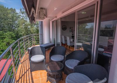 Spacious balcony with comfortable seating and scenic views