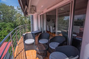 Spacious balcony with comfortable seating and scenic views