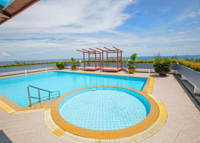 Luxurious outdoor pool with a scenic view and lounge area