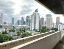 Spacious balcony with expansive city skyline view