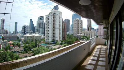 Spacious balcony with a panoramic view of the city skyline