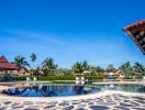 Bright and spacious outdoor pool area with sun loungers and lush landscaping