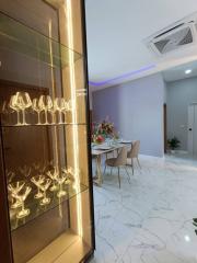 Elegant dining area with modern lighting and marble flooring