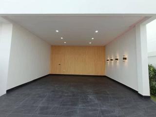 Spacious and modern building entrance with wooden wall paneling and tiled flooring