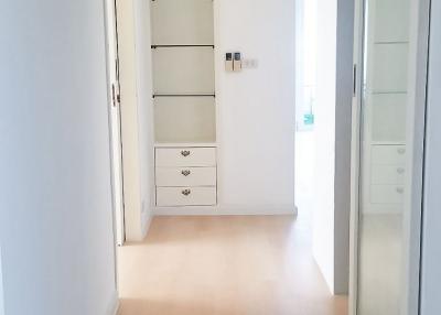Bright corridor with modern white storage cabinets