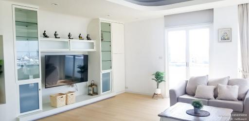 Modern living room with natural light and open shelving