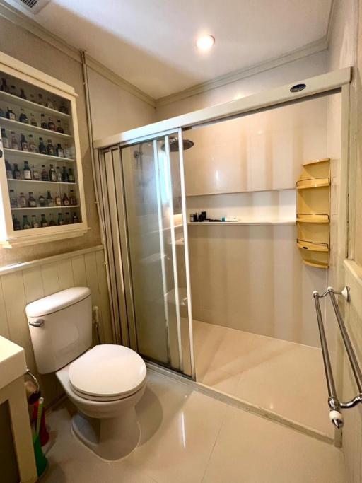 Clean and modern bathroom with glass shower enclosure