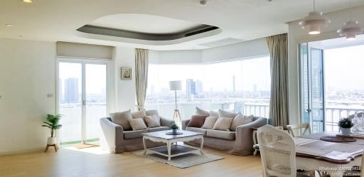 Spacious and bright living room with city skyline view