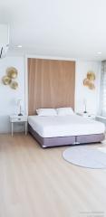 Modern bedroom with a minimalist design and decorative wall art