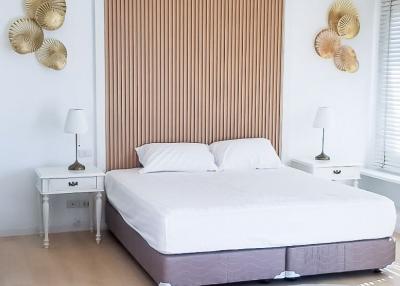 Modern bedroom with a minimalist design and decorative wall art