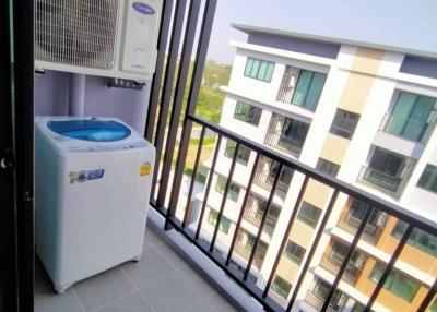 Compact balcony with air conditioning units and washing machine
