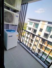 Compact balcony with air conditioning units and washing machine