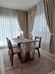 Elegant dining room with a wooden table and comfortable chairs