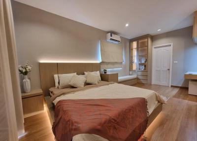 Cozy bedroom with modern wooden design and warm lighting