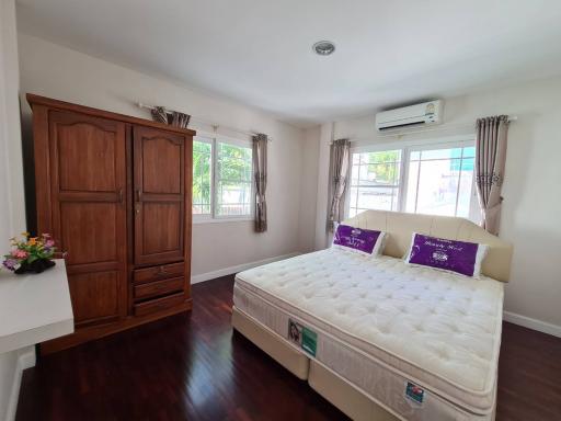 Spacious Bedroom with Air Conditioning and Natural Light