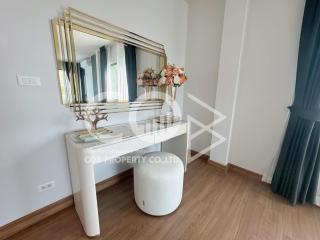 Modern bedroom interior with elegant dressing table and decorative mirror