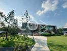 Modern two-story building exterior with landscaped garden