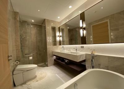 Modern spacious bathroom with double vanity and large mirror