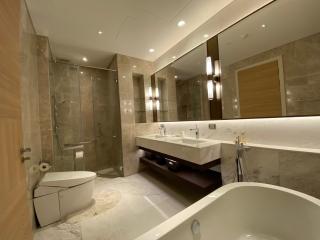 Modern spacious bathroom with double vanity and large mirror