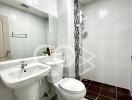 Modern bathroom with white tiling and fixtures