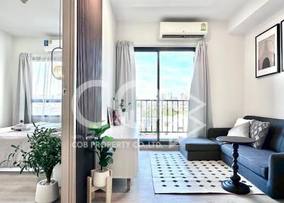 Modern living room with natural light and balcony access