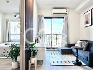 Modern living room with natural light and balcony access