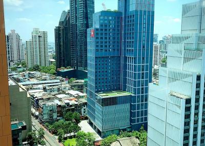 View of a vibrant cityscape from a high-rise building window