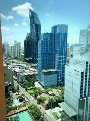 View of a vibrant cityscape from a high-rise building window