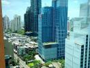 View of a vibrant cityscape from a high-rise building window