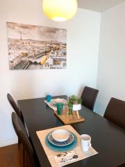 Modern dining area with table set for two