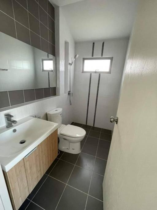 Modern bathroom interior with tiled walls and flooring