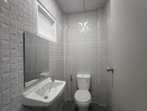 Modern bathroom interior with gray tiles