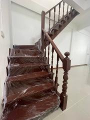 Wooden stairway with protective plastic covering