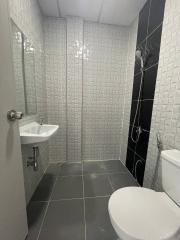 Modern bathroom with white and black tiles