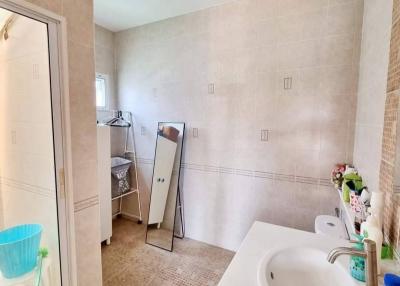 Bright bathroom with shower and tiled floors