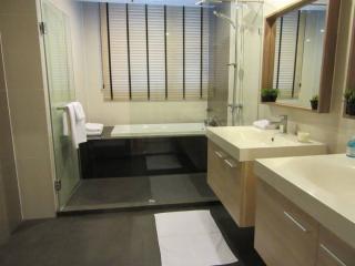 Modern bathroom with a large bathtub and double vanity