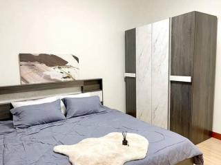 Cozy bedroom interior with a comfortable bed and stylish wardrobe