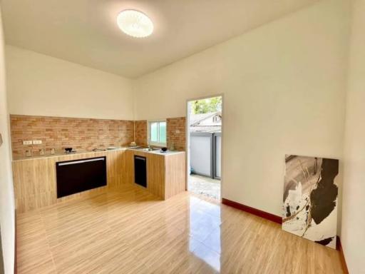 Modern kitchen with wooden cabinetry and natural light