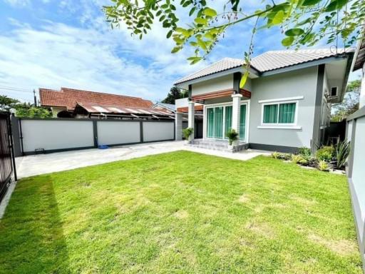 Modern suburban house with spacious green lawn