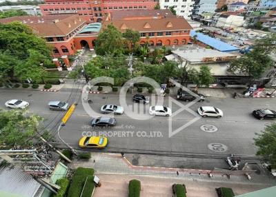 Aerial view of a busy street from a high-rise apartment
