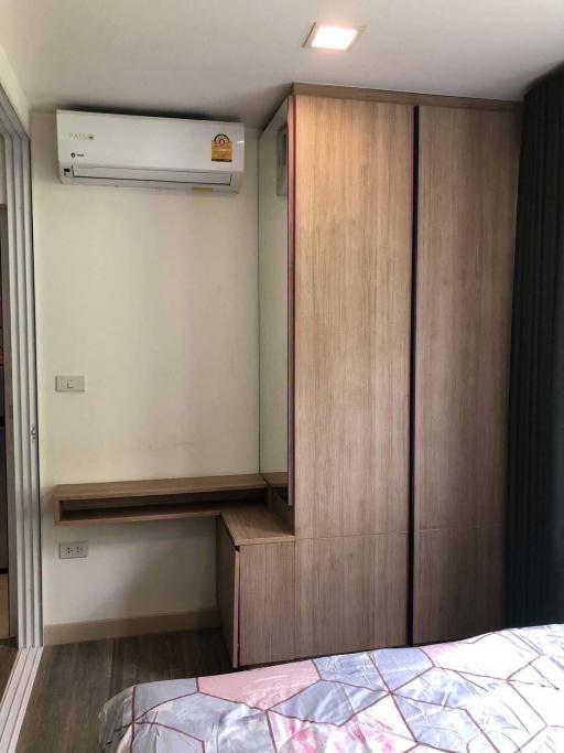 compact bedroom with air conditioning and built-in wardrobe